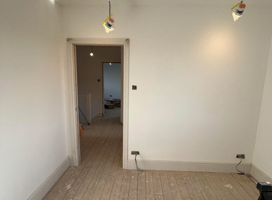 Electrician rewiring a home in East Sussex – full and partial rewire services in Bexhill, Eastbourne, Hastings, NICEIC certified, house rewire near me